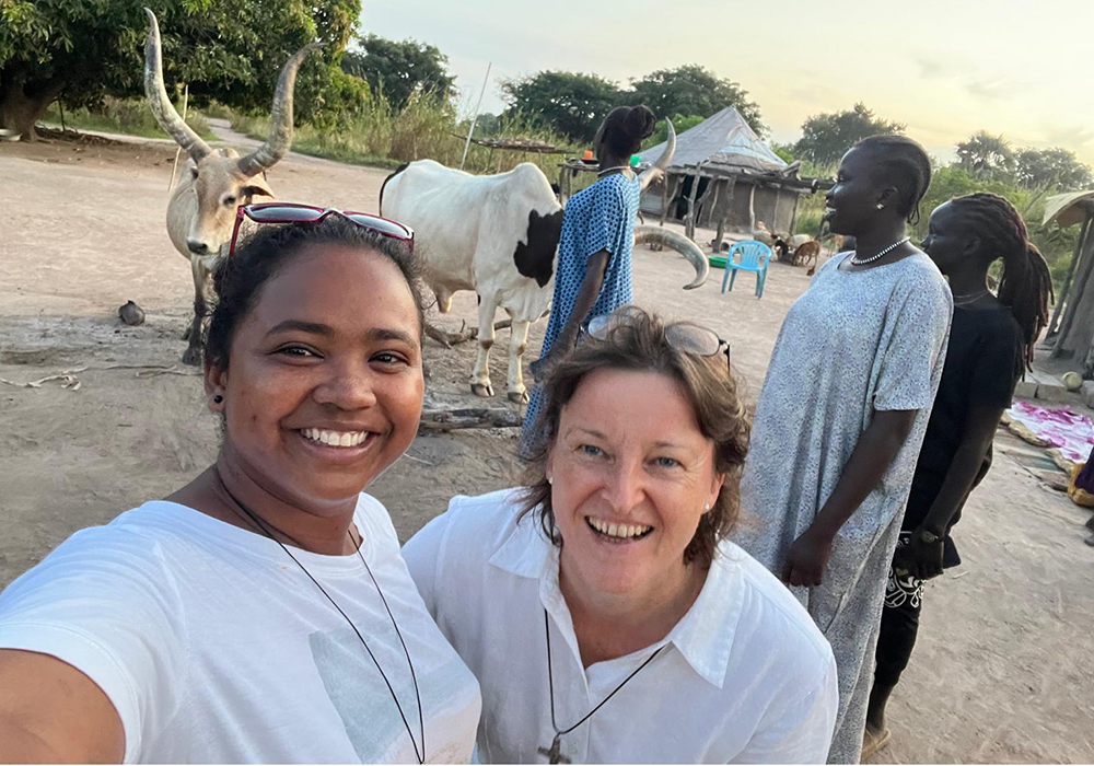 Sister Pryanka of the Institute of the Blessed Virgin Mary and Sister Helena of the Congregation of Jesus, visiting neighbors in Rumbek, South Sudan (Courtesy of Noelle Corscadden)