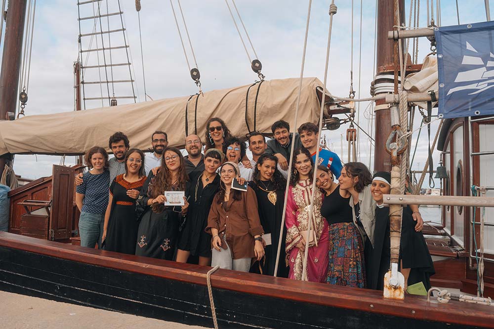 A group of young participants in the final stage of the Bel Espoir voyage poses with Sr. Abir Hanna, coordinator of the network of monasteries that accompanied the youth. (Courtesy of Jesús Marro Sanz)