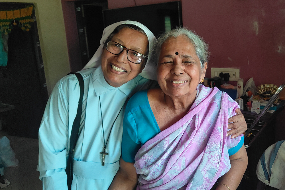 Sr. Melania D'Souza embraces Gulabi Sundar, the only living member of the initial women's group in Nejar. (Thomas Scaria)