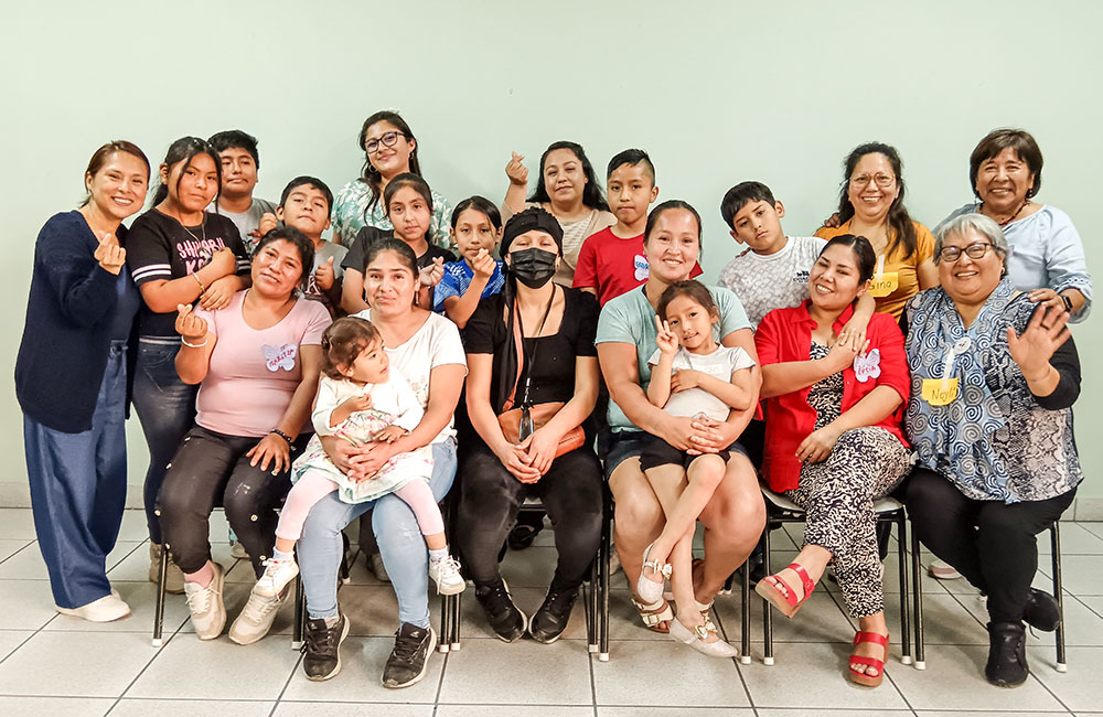 Holy Cross Sr. Noylí Margo Ríos Manzo, seated far right, celebrates Christmas with women and their children in Peru. (Courtesy of Noylí Margo Ríos Manzo)