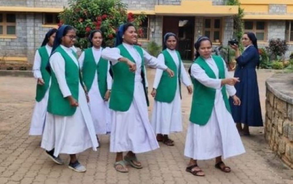Sr. Soniya K. Chacko, a member of the Daughters of Charity of St. Vincent De Paul, appears with community members during a photo shoot in Vellanchira, Chalakudy, Kerala, southwestern India. The Rotary Club of Thiruvananthapuram selected her for its Digital Missionary Award of 2025, citing her courage, clarity and conviction in using social media to witness her faith. (George Kommattam)
