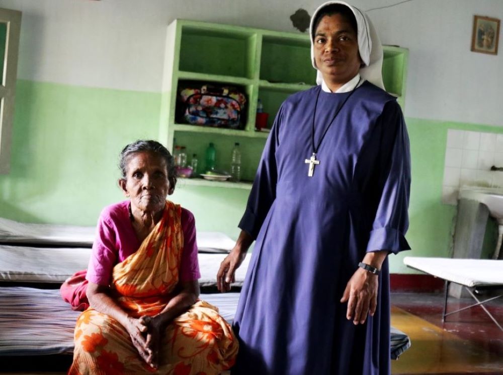 Maria Bambina Sr. Flora Rozario, 45, cares for Catharine Murmu, a tuberculosis patient without any relatives who has been staying at the sisters' tuberculosis shelter for several years. (Stephan Uttom Rozario)
