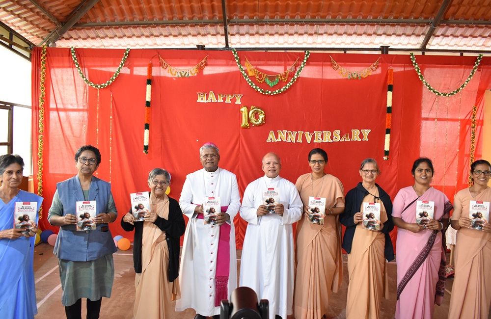 Bambina Sr. Adele Korah, third from left, stands with Auxiliary Bishop Joseph Susainathan of Bangalore and Fr. Francis Kodiyan, Prison Ministry India national coordinator, and nun volunteers, for the release of Korah's book My Journey With Brethren Behind Bars. (Courtesy of Sr. Adele Korah)