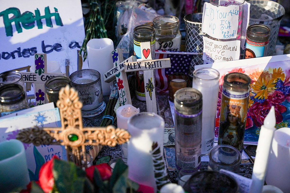 Crosses and candles are placed at a makeshift memorial in Minneapolis Jan. 28, 2026, at the site where Alex Pretti, a 37-year-old intensive care unit nurse was fatally shot by federal agents. (OSV News/Reuters/Seth Herald)