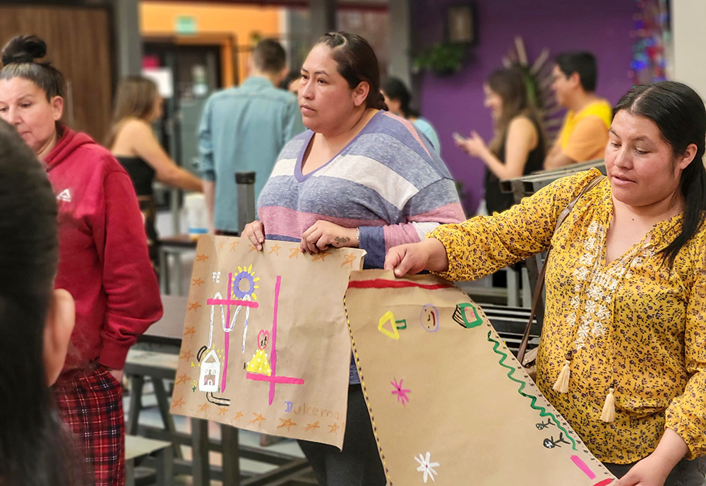 Migrant mothers share some of their art expressions during Mother's Day activities in the Kino Border Initiative comedor in Nogales, Mexico. (Courtesy of Eileen McKenzie)