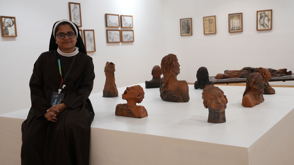 Sr. Roswin Joy, a member of the Congregation of the Mother Carmel, poses at the Kochi-Muziris Biennale pavilion in Kochi, Kerala, southwestern India. Her sculptures and drawings are on display at India's largest contemporary art exhibition featuring 66 artists from across the world. (Courtesy of Roswin Joy)