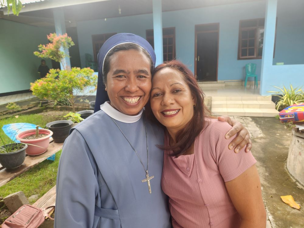Sr. Fransiska Imakulata, of the Missionary Sisters Servants of the Holy Spirit, poses with abuse survivor Evi Bota Sao, at a shelter for women and children operated by the nongovernmental organization TRUK F, or the Flores Humanitarian Volunteer Team, in the city of Maumere in eastern Indonesia. (GSR photo/Chris Herlinger)