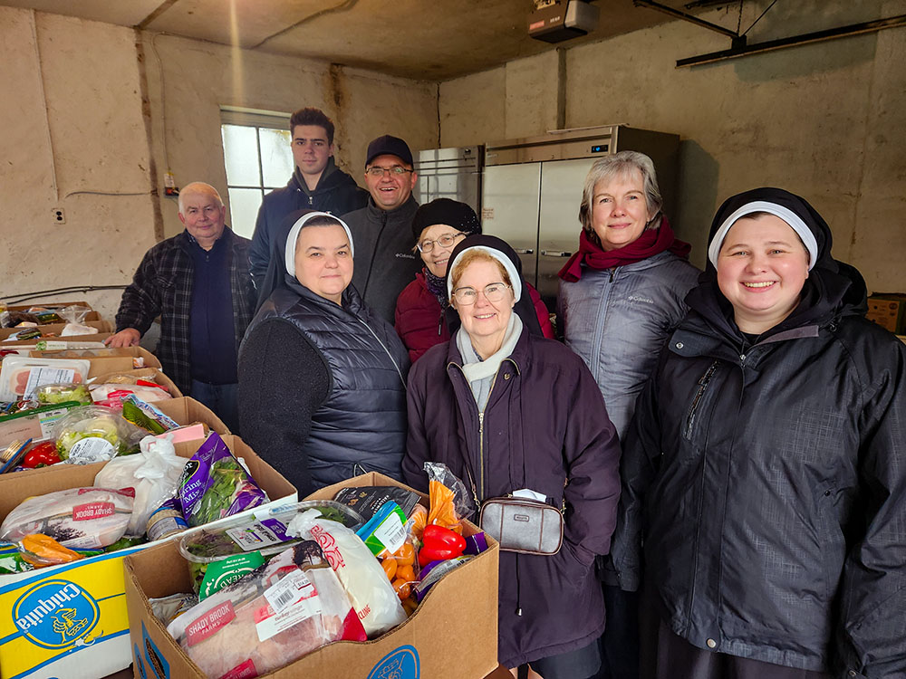 Basilian sisters and volunteers work Fridays on the grounds of the U.S. provincial motherhouse and distribute food boxes to recent Ukrainian arrivals. (GSR photo/Chris Herlinger)