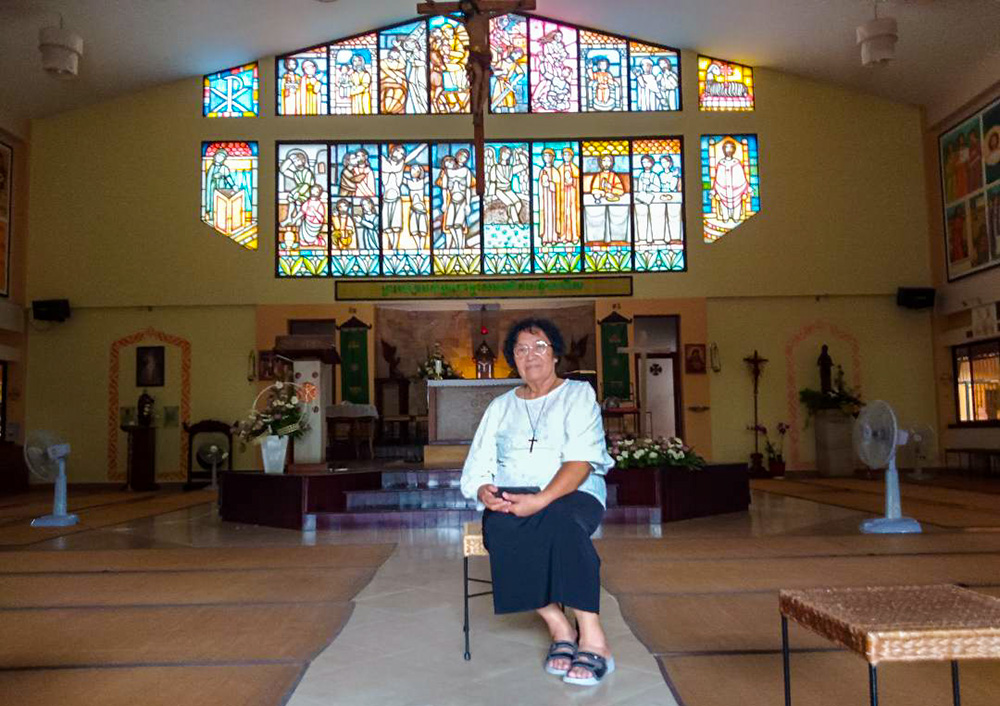 Sr. An Lucie Kim Nga poses for a photo in Child Jesus Catholic Church in Phnom Penh, Cambodia. The Vietnamese-born superior of the Sisters of Providence in Cambodia said she is driven by serving God and reconciliation between Cambodia and Vietnam. "If you have confidence in God, he will show you the way," she said. (Terry Friel)