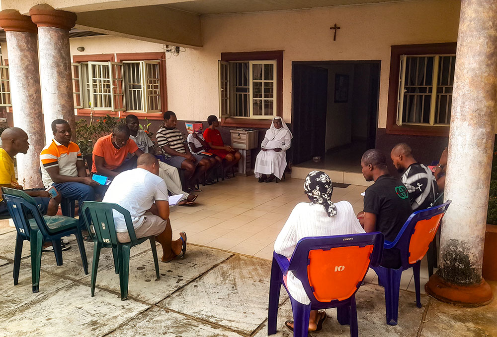Sr. Mary Fideltherese Ngwoke, a Sister of the Immaculate Heart of Mary, Mother of Christ, holds a group therapy session with clients at the Mater Christi Human Development and Religious Formation Centre in Amawbia, Nigeria. (John Chukwu)