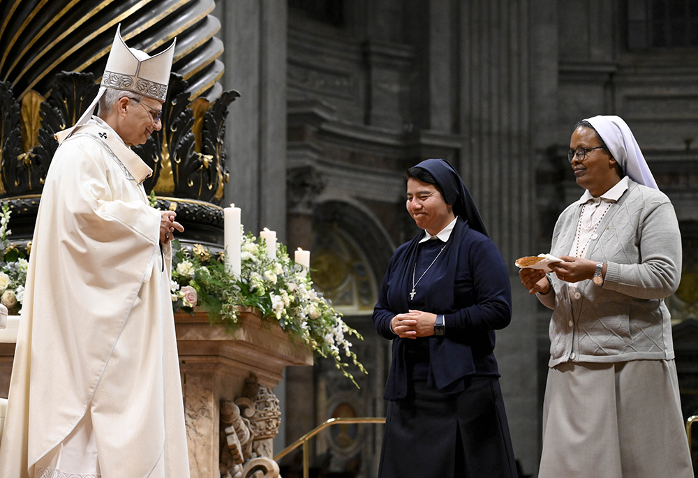 Pope Leo XIV receives the gifts from women religious as he celebrates Mass marking the feast of the Presentation of the Lord in St. Peter's Basilica at the Vatican Feb. 2, 2026. The Mass also marked the Vatican celebration of the World Day for Consecrated Life. (OSV News/Vatican Media/Simone Risoluti)