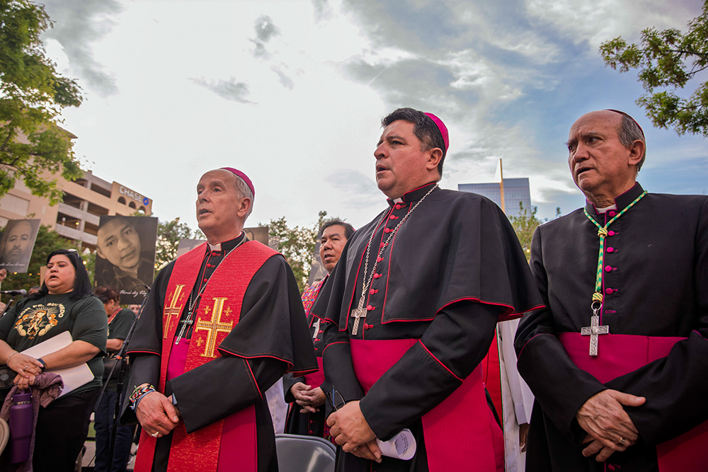 Bishop Mark Seitz of El Paso, Texas, Auxiliary Bishop Evelio Menjivar of Washington, D.C., and Bishop José Guadalupe Torres Campos of Ciudad Juárez, Mexico, take part in a vigil and protest in El Paso March 24, 2026, against mass deportations and the immigration policies of the Trump administration. (OSV News/Courtesy of El Paso Diocese/Fernando Ceniceros) 