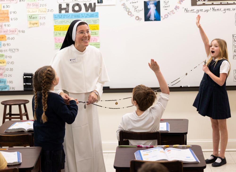 Sr. Amelia Hueller of the Dominican Sisters of St. Cecilia Congregation in Nashville, Tenn., visits a third-grade classroom at Providence Academy in Plymouth, Minn., Jan. 12, 2026, and explains her habit to the students, including Emily Jewison, Duke Conway and Grace Wheeler. (OSV News/Dave Hrbacek, The Catholic Spirit)