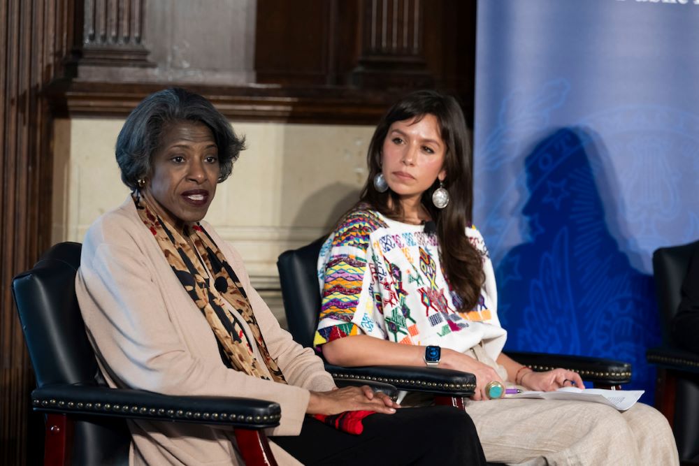 Cynthia Bailey Manns (left), director of Adult Learning at St. Joan of Arc Catholic Community in Minneapolis, speaks at a Georgetown University panel March 9 while Joanna Arellano-Gonzalez, co-founder of the Coalition for Spiritual and Public Leadership, listens. (Georgetown University/Lisa Helfert)