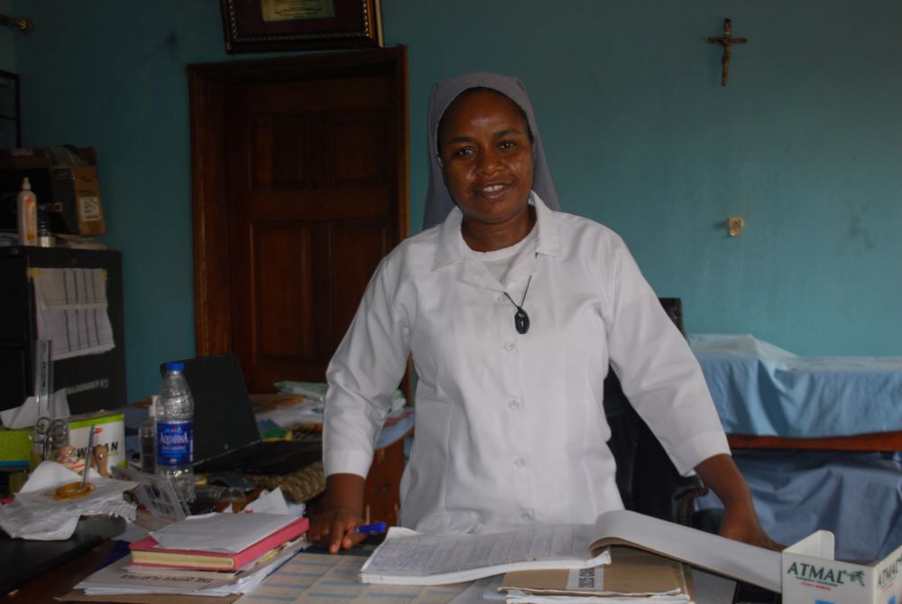 Sr. Nwanneka Udu, a member of the Congregation of the Medical Missionaries of Mary, poses in her office at the Mile Four Hospital in Abakaliki, Nigeria. She and other sisters and medical staff at the facility care for people with leprosy, including maternity and neonatal care, and other medical services. (Valentine Benjamin)