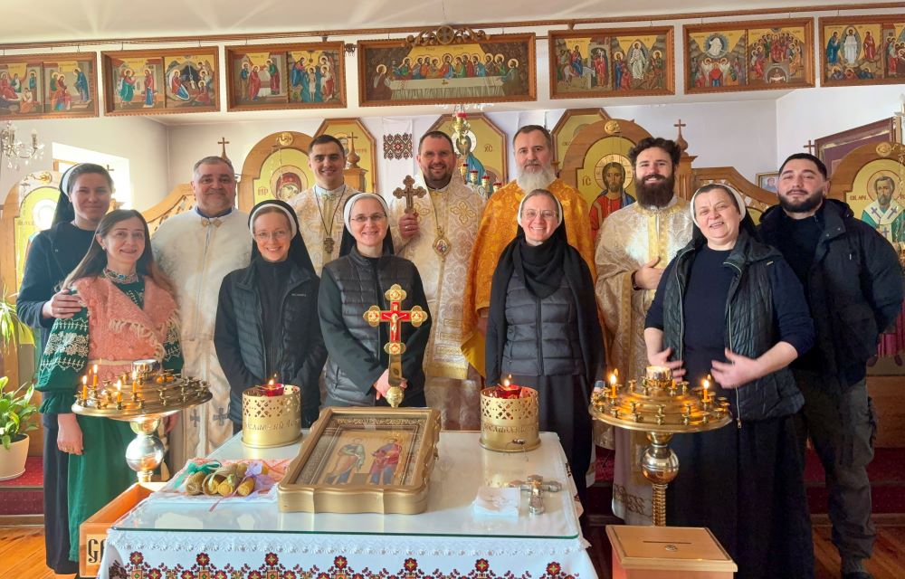 Bishop Maksym Ryabukha of Donetsk Exarchate, center, is pictured with sisters and priests after the divine liturgy at the Basilian Sisters monastery in Zaporizhzhia, Ukraine. (Courtesy of Anhelina Yaroshenko)