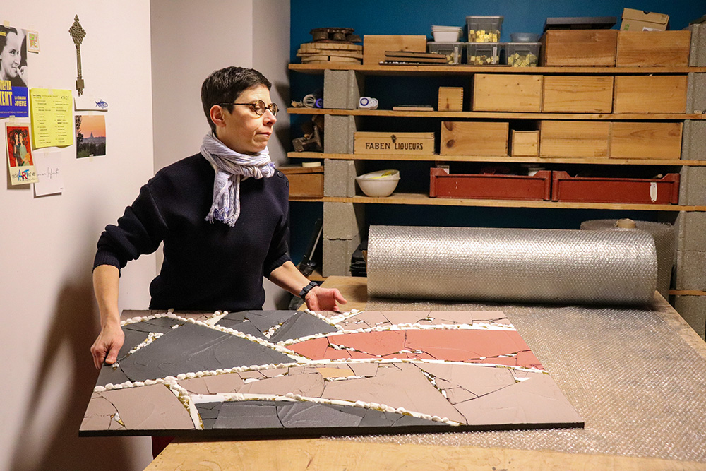 Mosaic artist Sister Samuelle in her workshop in France. Samuelle, who accused disgraced priest artist Marko Rupnik of abuse, is now a hermit and the creative lead on "Rebirth," a monumental mosaic dedicated to the victims of spiritual and sexual abuse in the church. (Courtesy of "Rebirth: The Tesserae Symphony")