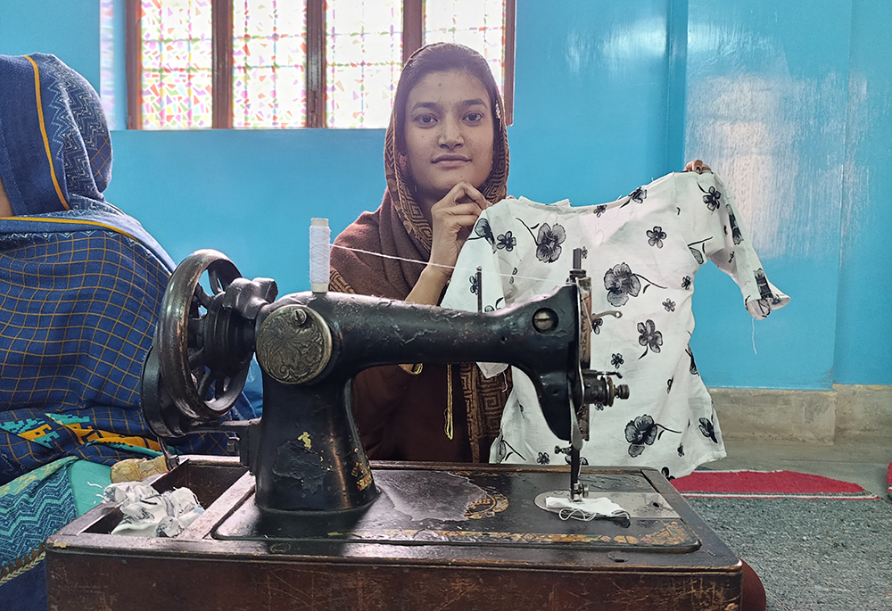  Maryam Younas displays a shirt she made at the sewing center run by the Franciscan Tertiary Sisters of Lahore. (Kamran Chaudry)