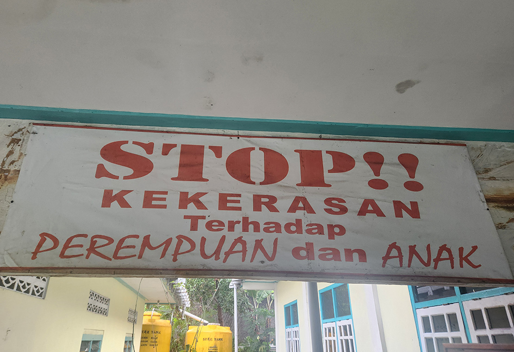 "Stop violence against women and children," reads the banner in the Indonesian language at the Good Shepherd community center in Ruteng, Indonesia. (GSR/Chris Herlinger)