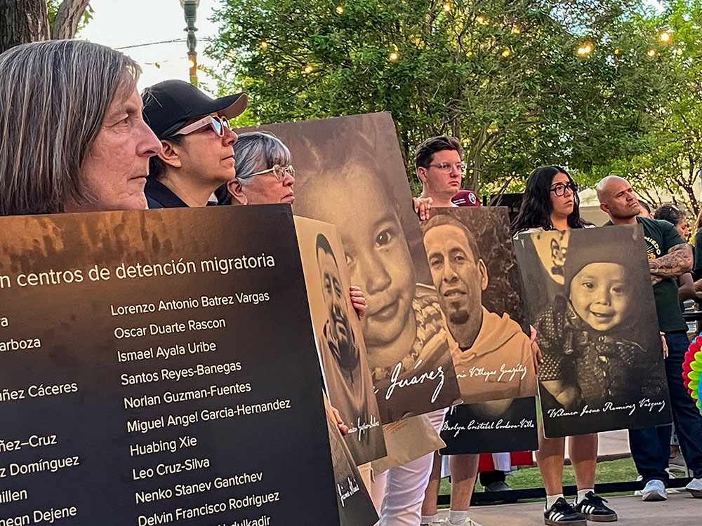 Demonstrators hold placards with photographs and names of people who died in immigration-related circumstances as they take part in a protest in El Paso, Texas, March 24, 2026, against mass deportations and the immigration policies of the Trump administration. (NCR photo/Pauline Hovey).
