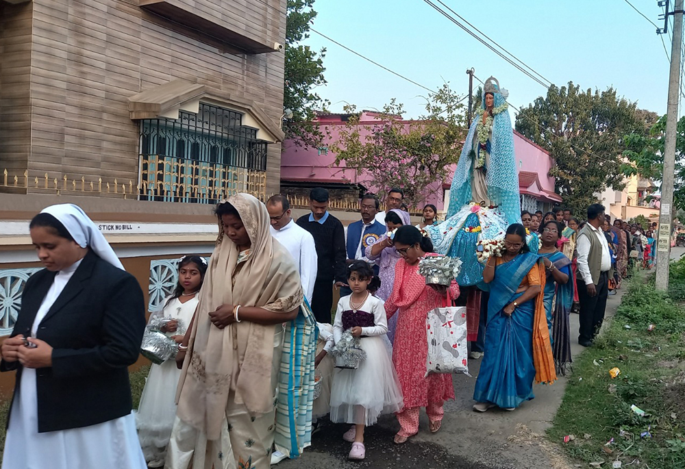 Salesian Sr. Rose Mary leads a Marian procession in connection with a Marian festival in a village near the Basilica of the Holy Rosary parish at Bandel, West Bengal state. (Courtesy of Fr. John Chalil)