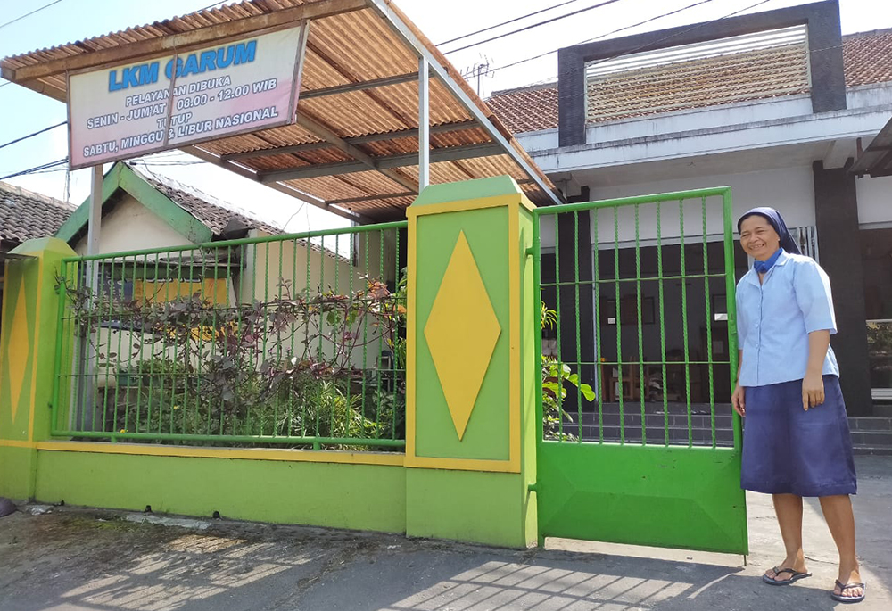 Sr. Gracia L. Suparti of the Daughters of Charity gets ready for a home visit. In 2019, Suparti founded the Migrant Family Association in Garum, a small sub-district near Blitar's capital, to help migrant families with their expenses and navigating poverty-related issues. (Courtesy of the Daughters of Charity)