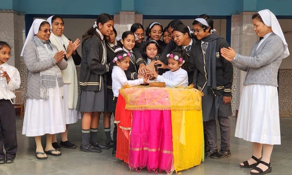 Children celebrate a birthday at the Auxilium High School in Bandel, West Bengal state. Sr. Celine Alexander (second from left) is the superior of the local convent that includes seven sisters. (Courtesy of Celine Alexander)