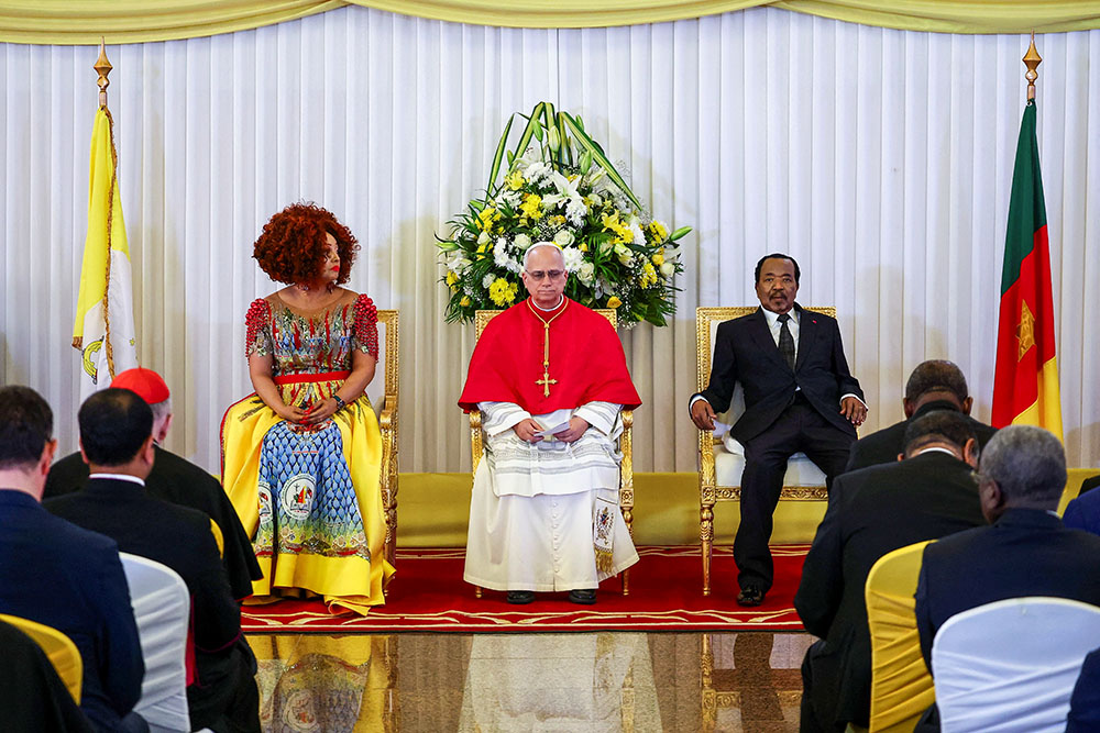 Pope Leo XIV meets with Cameroon President Paul Biya and his wife, Chantal Biya, after arriving at the Presidential Palace in Yaoundé April 15, 2026. (OSV News/Reuters/Guglielmo Mangiapane)