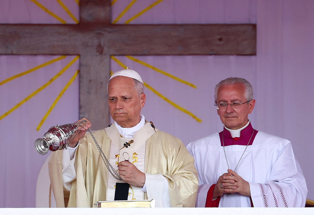 Pope Leo XIV swings a censer over the altar as he celebrates Mass at Saurimo esplanade in northeastern Angola April 20, 2026. (OSV News/Reuters/Guglielmo Mangiapane)