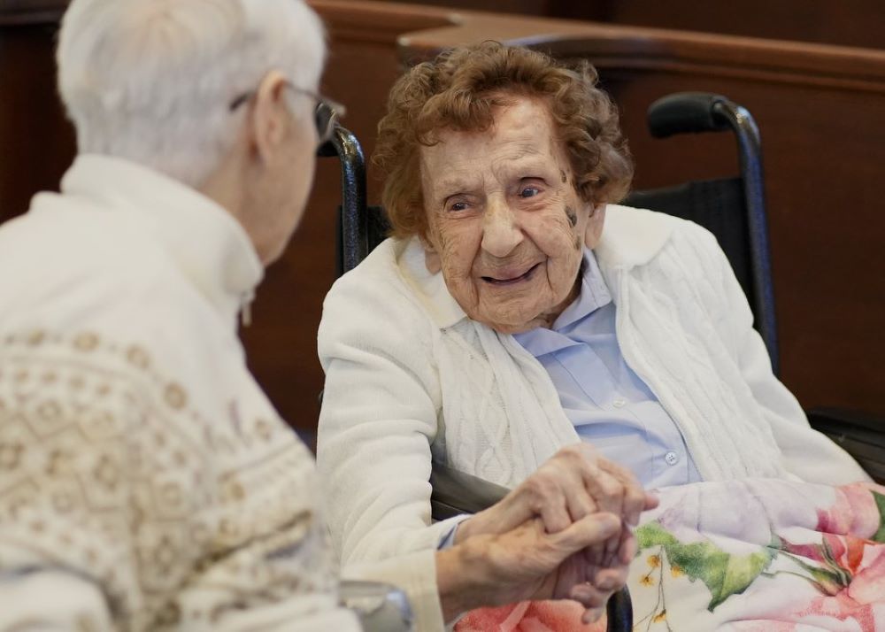 Sr. Francis Dominici Piscatella, right, a Sister of St. Dominic of Amityville, N.Y., who is recognized as the world's oldest nun, chats with Sr. Joanne Walters before attending Mass on her 113th birthday at the Dominican Sisters' motherhouse in Amityville April 20, 2026. (OSV News/Gregory A. Shemitz)