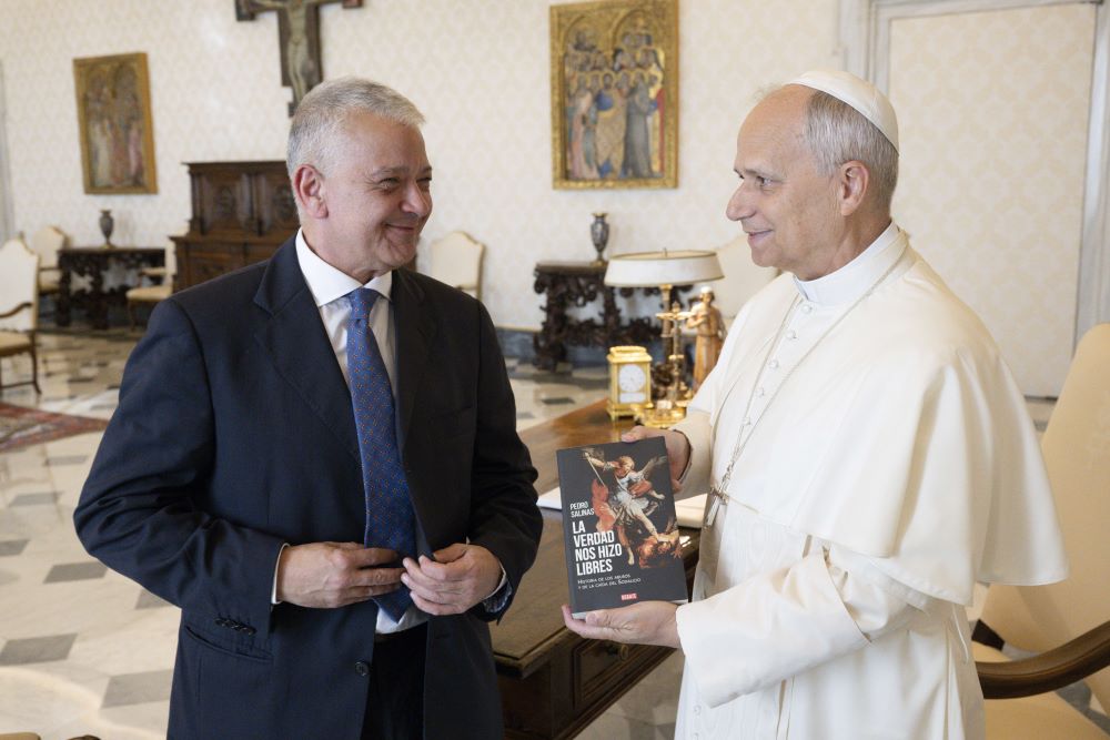 Pope Leo XIV meets with Pedro Salinas, a Peruvian journalist and abuse survivor, in the library of the Apostolic Palace at the Vatican Oct. 20, 2025. Salinas is a former member of Sodalitium Christianae Vitae who suffered physical and psychological abuse by the movement's founder, Luis Fernando Figari. (CNS/Vatican Media)