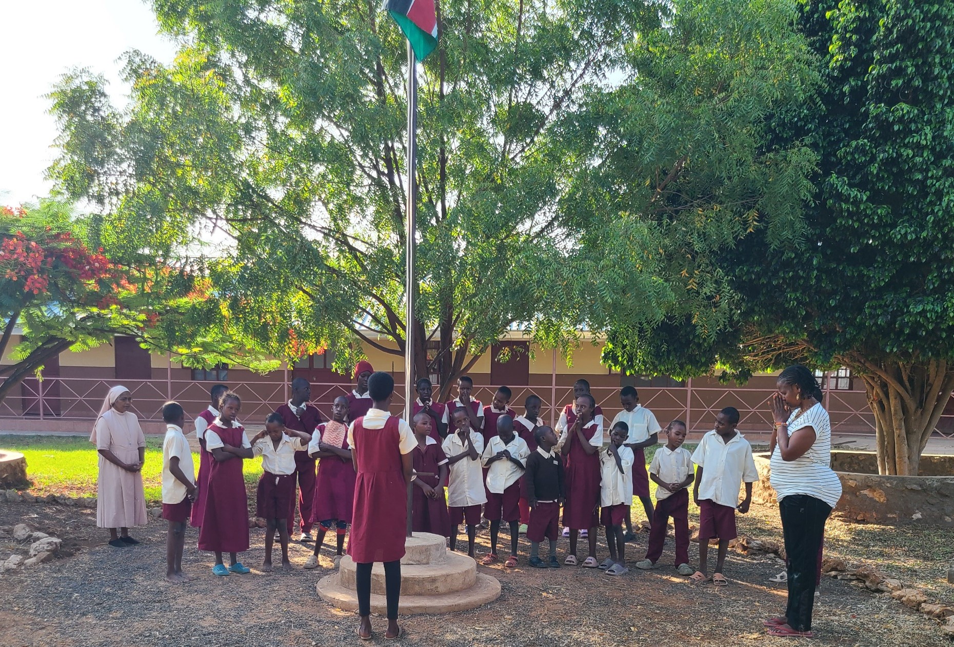 Children of the Divine Providence Home in Isiolo, Kenya, attend an assembly meeting with their teachers. Nirmala Dasi Sisters run the center, which focuses on children with mental disabilities who may also have physical disabilities. (Mourine Achieng)