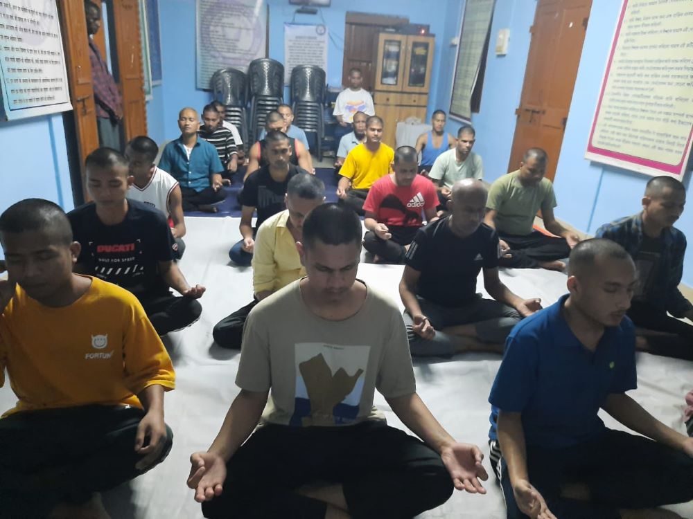 Patients of the Orsini Care Home participate in a yoga and meditation session as part of the treatment program at the facility in Bongaigaon, Assam state in northeastern India. (Courtesy of Merin Lukose)