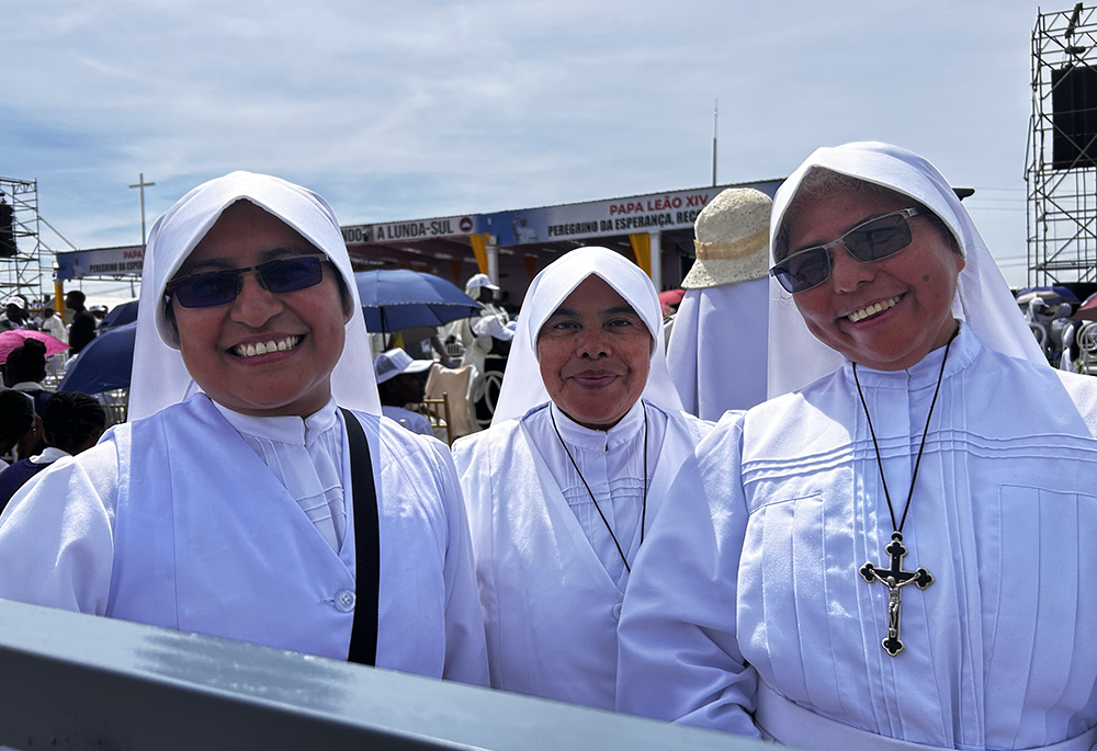 Sr. Dora Alicia Soriano Mendez, a member of the Missionaries of St. John the Baptist from Mexico, left, poses for a photo with other religious sisters before a papal Mass at Saurimo, Angola, April 20, 2026. (NCR photo/Justin McLellan)