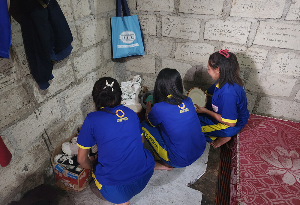 Three students in crowded rented housing in the city of Ruteng on the Indonesian island of Flores. The conditions of the housing and the well-being of the students are a focus of a group of Sisters of the Good Shepherd in Ruteng. (GSR photo/Chris Herlinger)