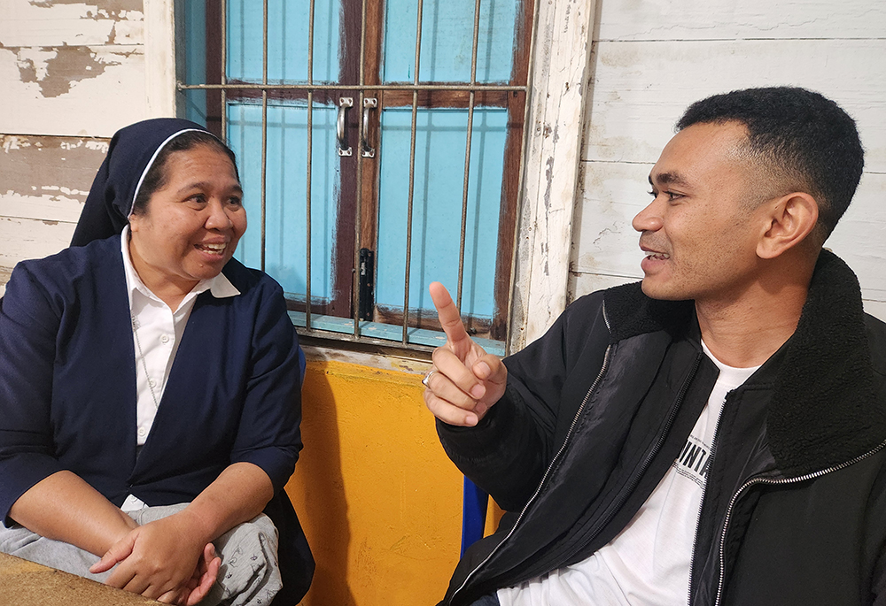 Sr. Flora Nirmala, unit leader of Good Shepherd Social Services in Ruteng, sits with Felix Magur, who heads governmental operations of the local subdistrict, who praised the ministries of the Good Shepherd sisters. (GSR photo/Chris Herlinger)