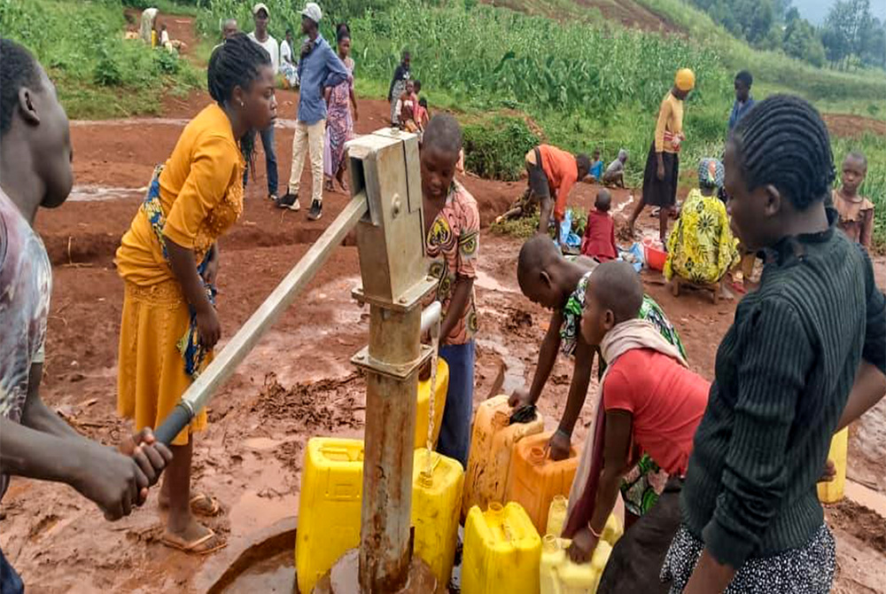 When improving access to water, local leadership is essential. Communities in Walungu Territory in South Kivu Province, Democratic Republic of Congo, form water committees to manage and maintain sources. Women play central roles — because they understand water needs best. (Courtesy of Rose Namulisa Balaluka)