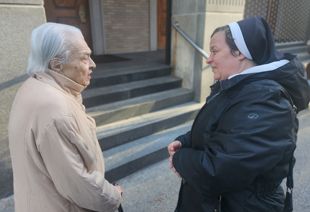 Just as she does back home in Ukraine, Sr. Lucia Murashko, a member of Sisters of the Order of St. Basil the Great, spoke warmly to a parishioner of St. George Ukrainian Catholic Church in Manhattan's East Village during a recent visit to New York City. (GSR photo/Chris Herlinger)