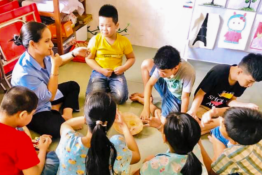 Sr. Veronica Truong Thi Binh teaches simple gestures to children with autism at a small center run by the Daughters of Charity in Dong Ha, Quang Tri Province, Vietnam, on Sept. 22, 2025. (Joachim Pham)