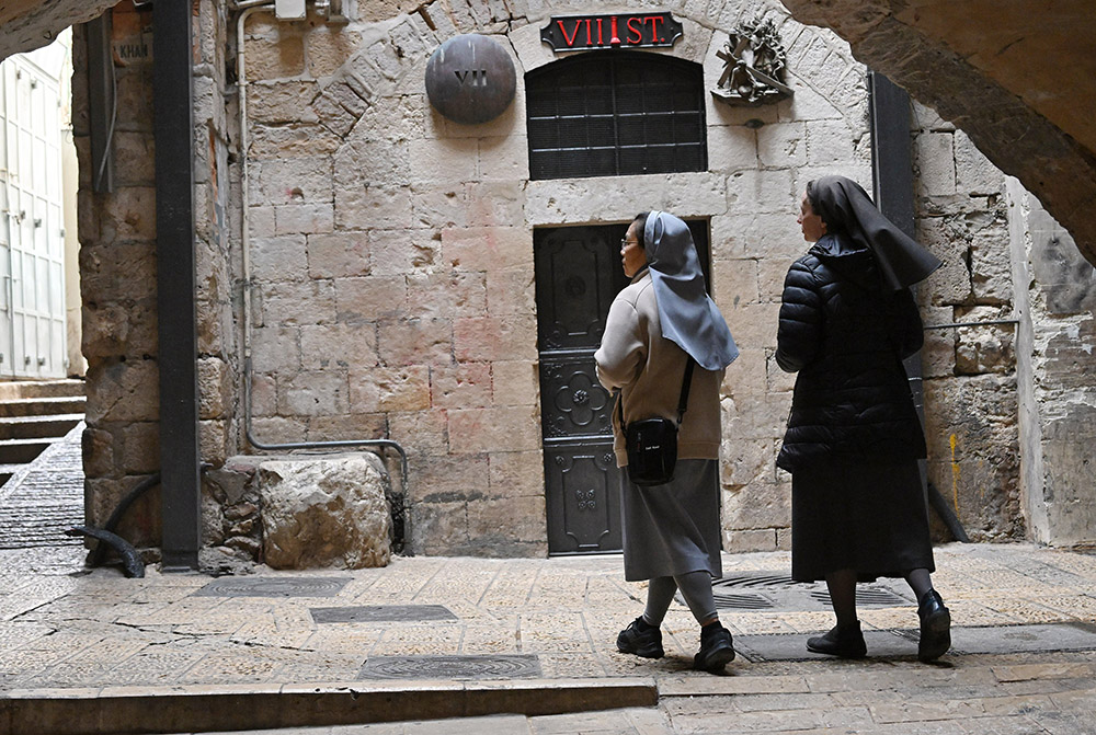 Nuns walk near the seventh station of the cross on Good Friday, in the Old City of Jerusalem, April 3, 2026. (OSV News/Debbie Hill)
