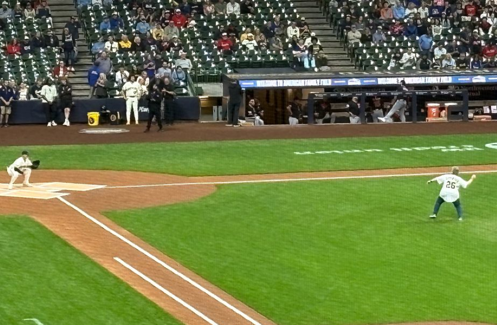 Sr. Debra Sciano throws out the ceremonial first pitch at a Milwaukee Brewers game June 17. Sciano, who will become president of the Leadership Conference of Women Religious Aug. 1, is such a big baseball fan she keeps score during games on a paper scorecard. (Courtesy of Kathy Sciano Lamb)