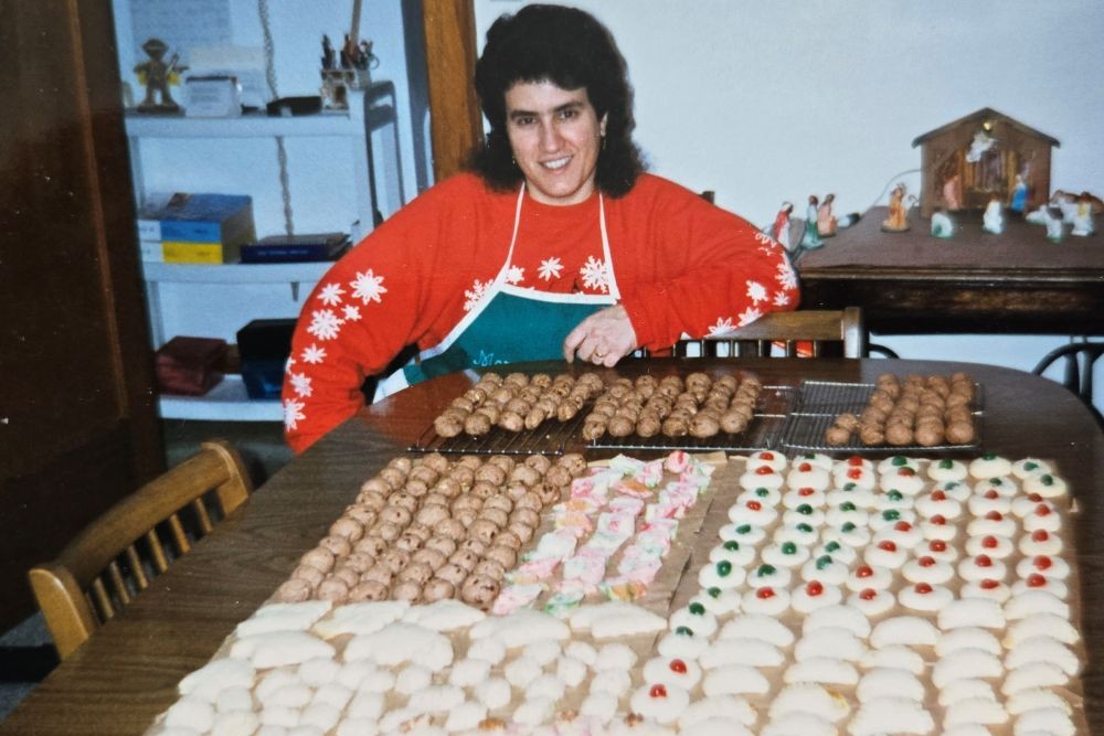 Sr. Debra Sciano poses in 1994 with the dozens of Italian cookies she loves to bake. (Courtesy of Debra Sciano)
