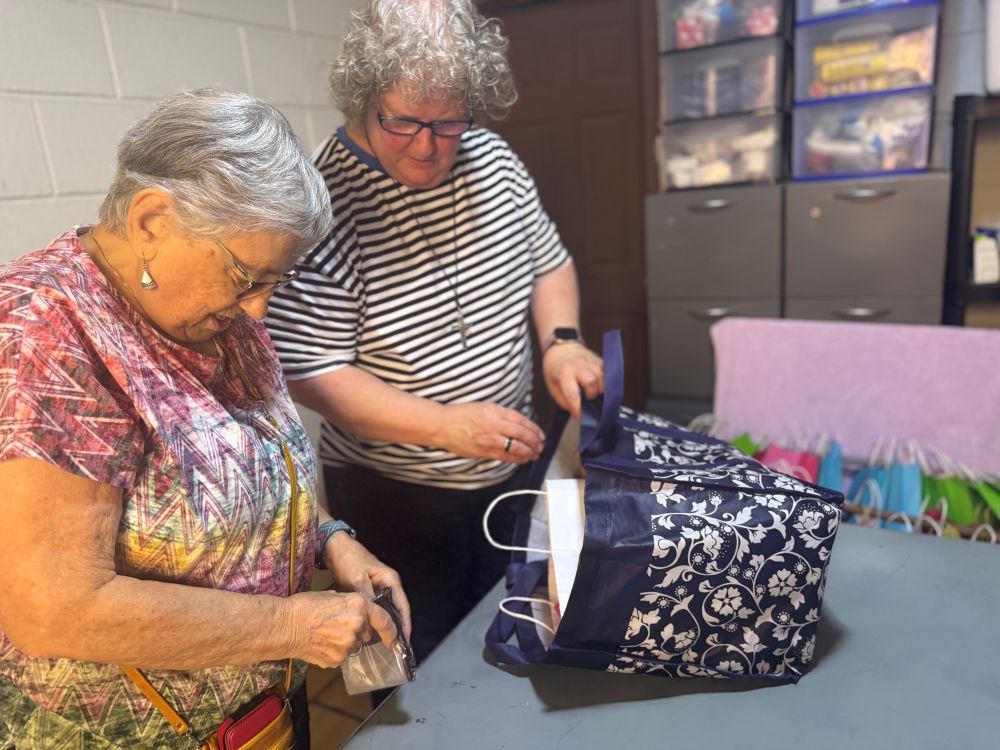 Rochester Franciscan Sr. Phyllis Sellner, of Palm Desert, California (left), and Society of the Sacred Heart Sr. Lisa Buscher prepare gifts for people at the Cobina Posada del Migrante shelter in Mexicali, Mexico, June 6, 2026. (GSR photo/Rhina Guidos)