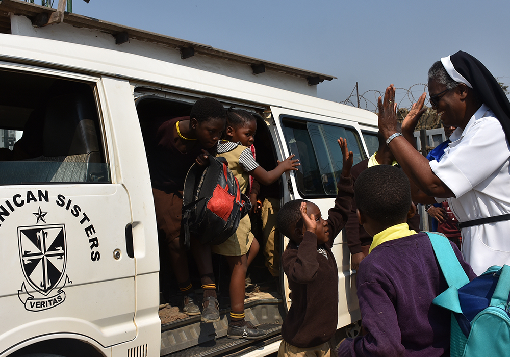 St. Anthony Children's Village program manager Dominican Sr. Bernadette Mwita welcomes pre and primary school children. The Dominican Missionary Sisters of the Sacred Heart of Jesus manage St. Anthony Children's Village in Ndola, Zambia. (Derrick Silimina)