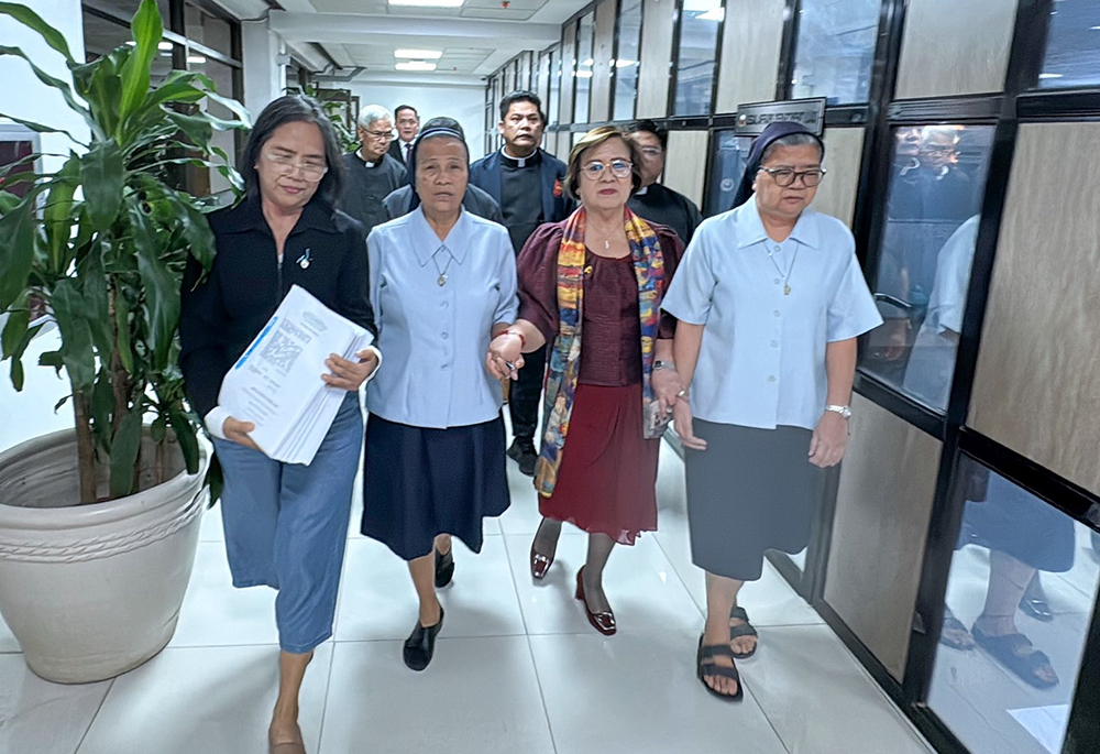 Sr. Geraldine Denoga, right, is one of three Daughters of Charity who filed an impeachment complaint against Vice President Sara Duterte on Feb. 9, 2026. She is accompanied by Sr. Nieves Servito, second from left, who came to support her fellow Daughters of Charity. (Courtesy of Office of Representative Leila de Lima)