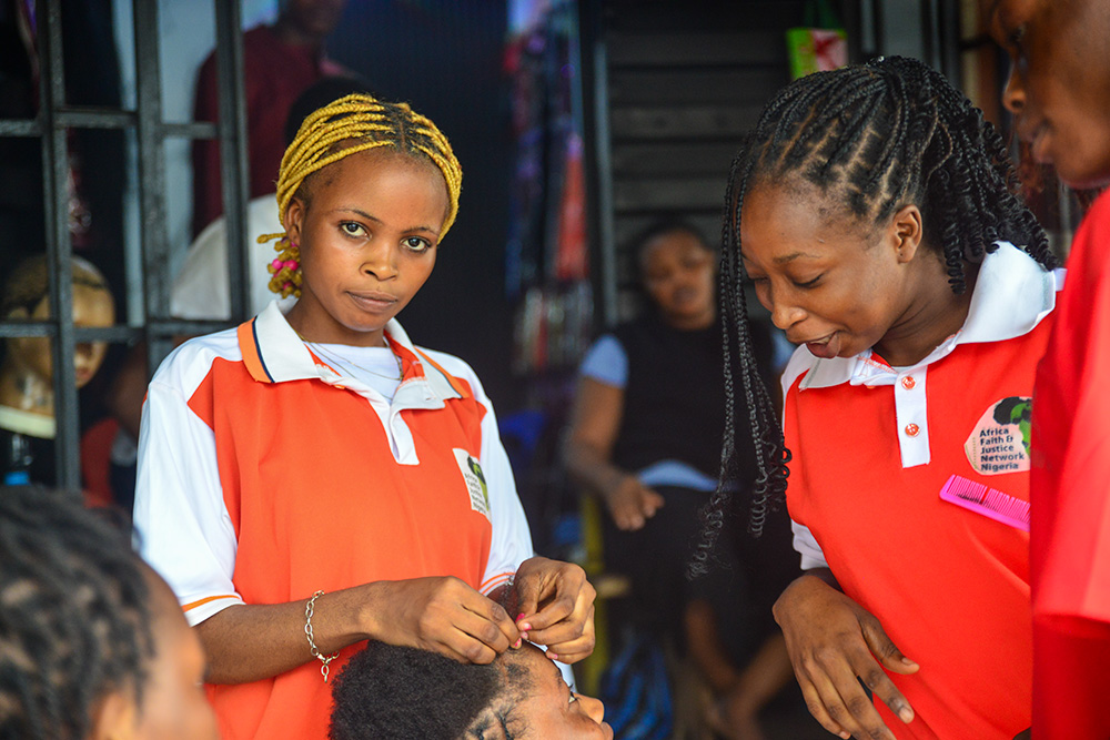 Veronica Boniface (left) says she wants to be a lawyer to help victims of child labor. (Patrick Egwu)
