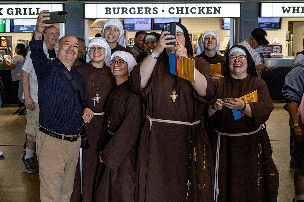 Nuns take a selfie ahead of a June 14, 2025, celebration in honor of Pope Leo XIV at Rate Field in Chicago, home of the Chicago White Sox baseball team. (OSV News/Reuters/Carlos Osorio)