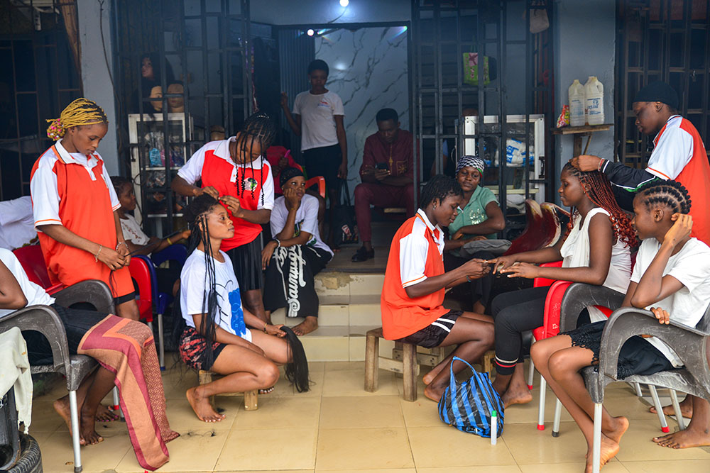 Young girls rescued by the Africa Faith and Justice Network learn hairdressing at a salon in southern Nigeria. (Patrick Egwu)