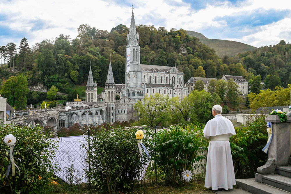 Pope Leo XIV looks at the Sanctuary of Our Lady of Lourdes from the hill of the Carmelite Monastery of Lourdes in France, Sept. 27, 2026, after a private meeting with contemplative religious sisters. Three days later, Leo met with a group of Dominican contemplatives at the Vatican. (CNS/Vatican Media)