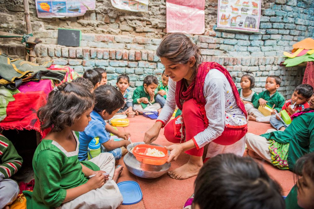 Children are served their school meal at a school in India in this 2017 photograph. (OSV News/Courtesy Mary's Meals)